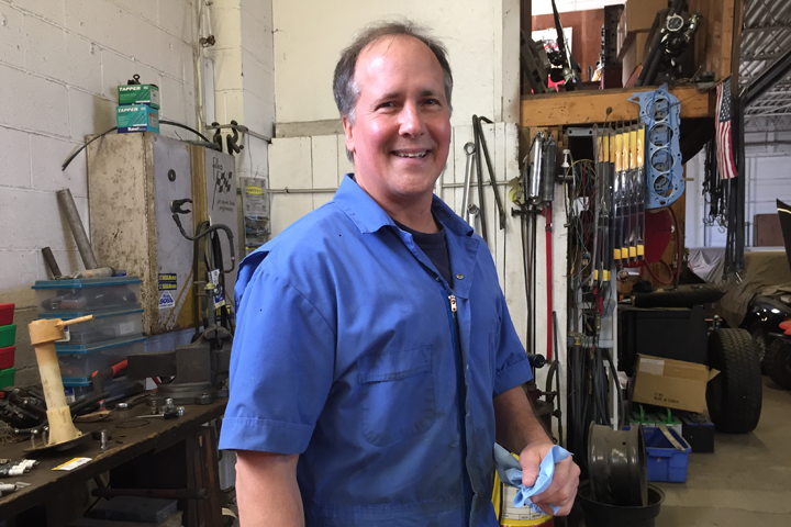 Ken Gardner, owner of Kenny’s Garage Auto Repair Shop in Erie PA completing a PA State Inspection safety check.